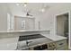 Modern kitchen features a sleek cooktop and breakfast bar at 2515 N Howard Ave, Tampa, FL 33607