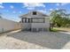 Light gray house with a gravel yard and privacy fence at 2515 N Howard Ave, Tampa, FL 33607