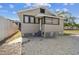 Light gray house with a gravel yard and privacy fence at 2515 N Howard Ave, Tampa, FL 33607