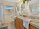 Bathroom with double vanity and bathtub at 2533 Duncan Dr, Belleair Bluffs, FL 33770