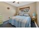 Bedroom with striped bedding and ceiling fan at 2533 Duncan Dr, Belleair Bluffs, FL 33770