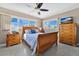 Bright bedroom with wood furniture and a ceiling fan at 2533 Duncan Dr, Belleair Bluffs, FL 33770