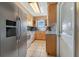 Cozy kitchen with light wood cabinets and stainless steel appliances at 2533 Duncan Dr, Belleair Bluffs, FL 33770