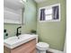 Bathroom featuring a modern sink, toilet, and shower with modern design at 2619 Miriam S St, Gulfport, FL 33711