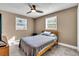 Cozy bedroom featuring tile floors, bright windows, and a comfortable bed at 2619 Miriam S St, Gulfport, FL 33711