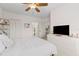 Main bedroom with a comfortable bed, ample closet space, and access to the bathroom at 2765 Via Cipriani # 1232B, Clearwater, FL 33764