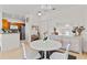 Bright dining area with white table and stylish storage at 2765 Via Cipriani # 1232B, Clearwater, FL 33764