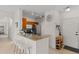Kitchen with granite counters, stainless appliances, and breakfast bar at 2765 Via Cipriani # 1232B, Clearwater, FL 33764