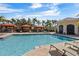 Resort-style pool with multiple cabanas and lounge chairs at 2765 Via Cipriani # 1232B, Clearwater, FL 33764