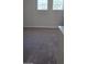 Spacious bedroom with neutral carpeting and large windows at 2933 Jacob Crossing Ln, Holiday, FL 34691