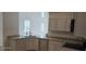 Modern kitchen with granite countertops and stainless steel appliances at 2933 Jacob Crossing Ln, Holiday, FL 34691