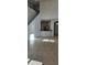 Open living area with high ceilings, tile floors, and kitchen view at 2933 Jacob Crossing Ln, Holiday, FL 34691