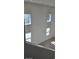 Bright living room with multiple windows and high ceilings at 2933 Jacob Crossing Ln, Holiday, FL 34691