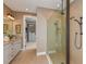Spa-like bathroom with walk-in shower and double vanity at 29658 Cassino Ct, Wesley Chapel, FL 33543