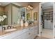 Elegant bathroom boasts double sinks and large walk-in closet at 29658 Cassino Ct, Wesley Chapel, FL 33543