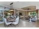 Elegant dining room with chandelier and mirrored wall at 29658 Cassino Ct, Wesley Chapel, FL 33543