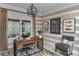 Bright home office with wood desk and comfortable seating at 29658 Cassino Ct, Wesley Chapel, FL 33543