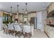 Bright kitchen with island, stainless steel appliances, and light-colored cabinetry at 29658 Cassino Ct, Wesley Chapel, FL 33543