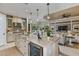 Island kitchen with stainless steel appliances and wine cooler at 29658 Cassino Ct, Wesley Chapel, FL 33543