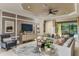 Relaxing living room with comfortable seating and pool view at 29658 Cassino Ct, Wesley Chapel, FL 33543