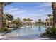 Resort-style pool with plenty of lounge chairs and umbrellas at 29658 Cassino Ct, Wesley Chapel, FL 33543