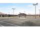 Well-lit outdoor tennis court at 29658 Cassino Ct, Wesley Chapel, FL 33543