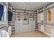 Bright and spacious walk-in closet with ample shelving and drawers at 29658 Cassino Ct, Wesley Chapel, FL 33543