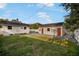 Large backyard with detached garage and grassy area at 3105 W Spruce St, Tampa, FL 33607