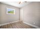 Bright bedroom with new flooring and an updated door at 3105 W Spruce St, Tampa, FL 33607