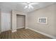 Simple bedroom with ceiling fan, closet, and light walls at 3105 W Spruce St, Tampa, FL 33607