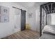 Bedroom with a full-size bed and an adjacent bathroom at 3105 W Spruce St, Tampa, FL 33607