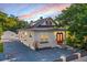 Charming bungalow with a white brick exterior and red front door at 3105 W Spruce St, Tampa, FL 33607