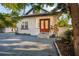 House exterior showcasing a red front door and white brick facade at 3105 W Spruce St, Tampa, FL 33607