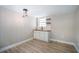 Updated kitchen features white cabinets, wood countertops, and modern lighting at 3105 W Spruce St, Tampa, FL 33607