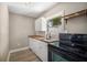 Renovated kitchen features butcher block countertops and white shaker cabinets at 3105 W Spruce St, Tampa, FL 33607
