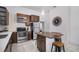 Updated kitchen featuring stainless steel appliances and granite island at 3105 W Spruce St, Tampa, FL 33607