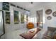 Sunlit living area with a comfy couch and a view of the backyard at 3105 W Spruce St, Tampa, FL 33607