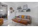 Bright living room with a brown couch and wooden coffee table at 3105 W Spruce St, Tampa, FL 33607