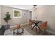 Living room with a dining area and modern light fixtures at 3105 W Spruce St, Tampa, FL 33607