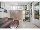 Living room featuring a brown couch, coffee table and stylish decor at 3105 W Spruce St, Tampa, FL 33607