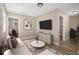 Spacious living room with light beige walls and a view into another room at 3105 W Spruce St, Tampa, FL 33607