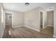 Open living area with wood floors, doors to other rooms and lots of natural light at 3105 W Spruce St, Tampa, FL 33607