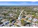 Aerial view of a single Gathering home with surrounding neighborhood at 3108 Ash Ct, Dunedin, FL 34698