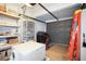 Garage workshop with ample storage and a rocking chair at 3108 Ash Ct, Dunedin, FL 34698