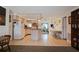 Kitchen with island, view into living room, and light wood cabinets at 3108 Ash Ct, Dunedin, FL 34698