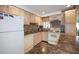 Cozy kitchen with light wood cabinets, granite countertops, and modern appliances at 3108 Ash Ct, Dunedin, FL 34698