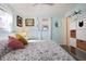 Main bedroom with King bed, closet and view to backyard at 3108 Ash Ct, Dunedin, FL 34698