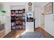 Home office features built-in shelving and hardwood floors at 3108 Ash Ct, Dunedin, FL 34698