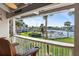 Relaxing balcony view of the lush green lawn, canal and waterfront homes at 380 Pinellas Bayway S. # E, Tierra Verde, FL 33715