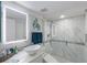 Modern bathroom featuring a glass-enclosed shower, vessel sink, and a lighted mirror for a contemporary feel at 380 Pinellas Bayway S. # E, Tierra Verde, FL 33715